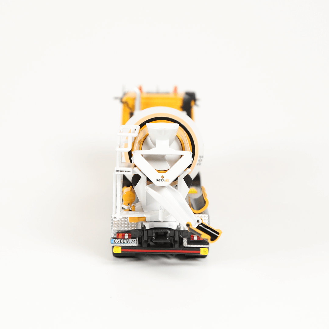 Model of a truck with a white and yellow color scheme on a light gray background