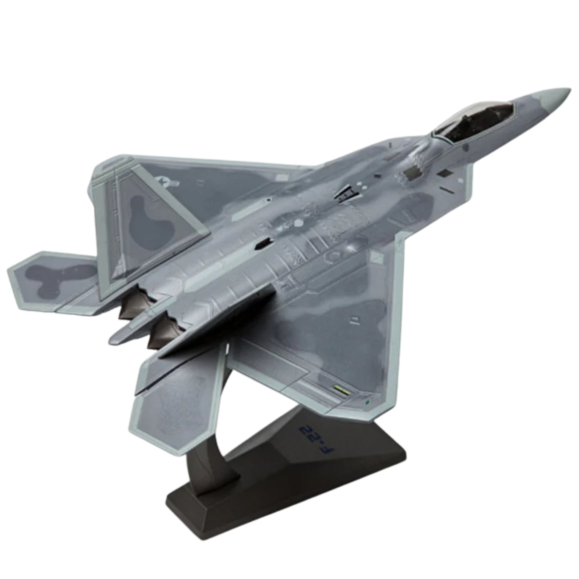 Model of a fighter jet on a stand with a white background