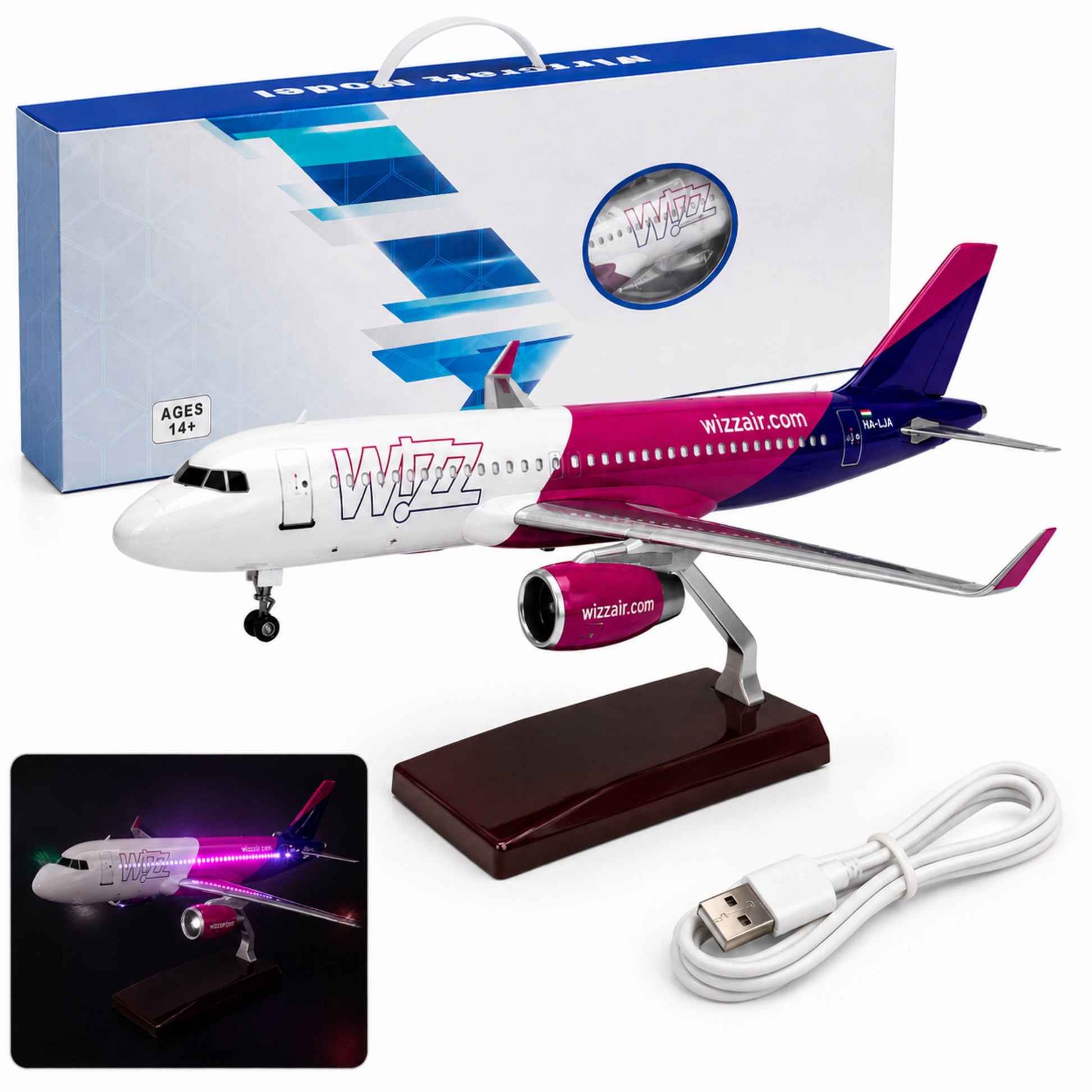 Model airplane with Wizz Air branding, packaging, and USB cable on a white background