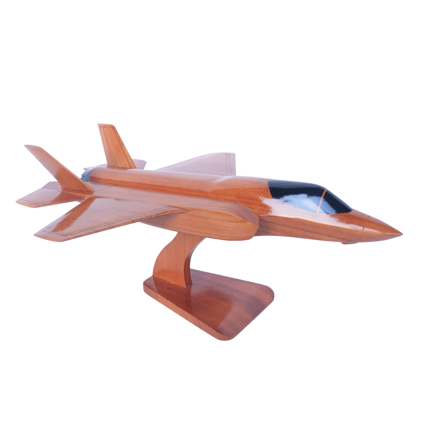 Wooden model of a fighter jet on a white background