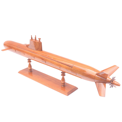 Wooden model of a submarine on a white background