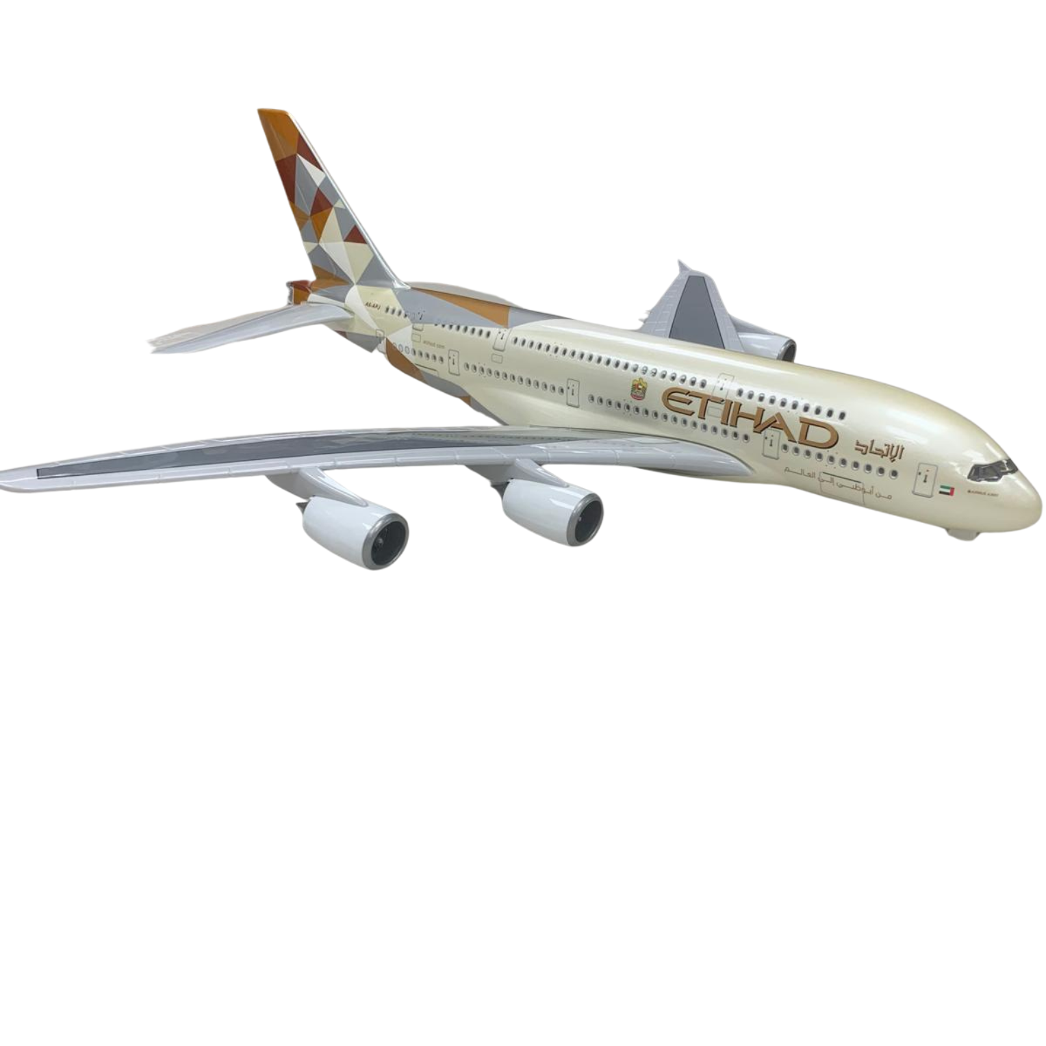 Model airplane with Etihad Airways livery on a white background