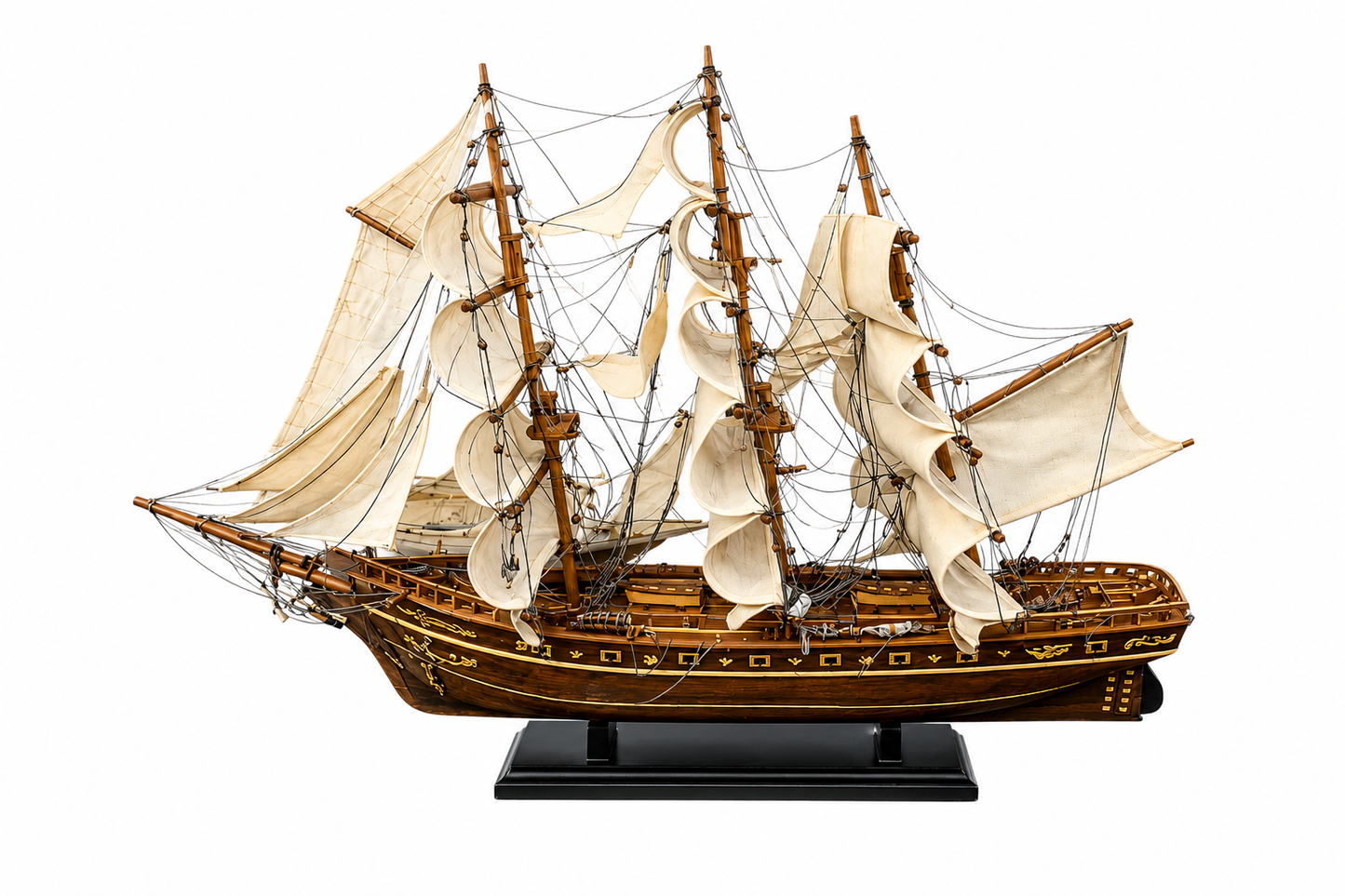 A detailed wooden model of a three-masted sailing ship with cream-colored sails and a black display stand, shown against a plain white background.