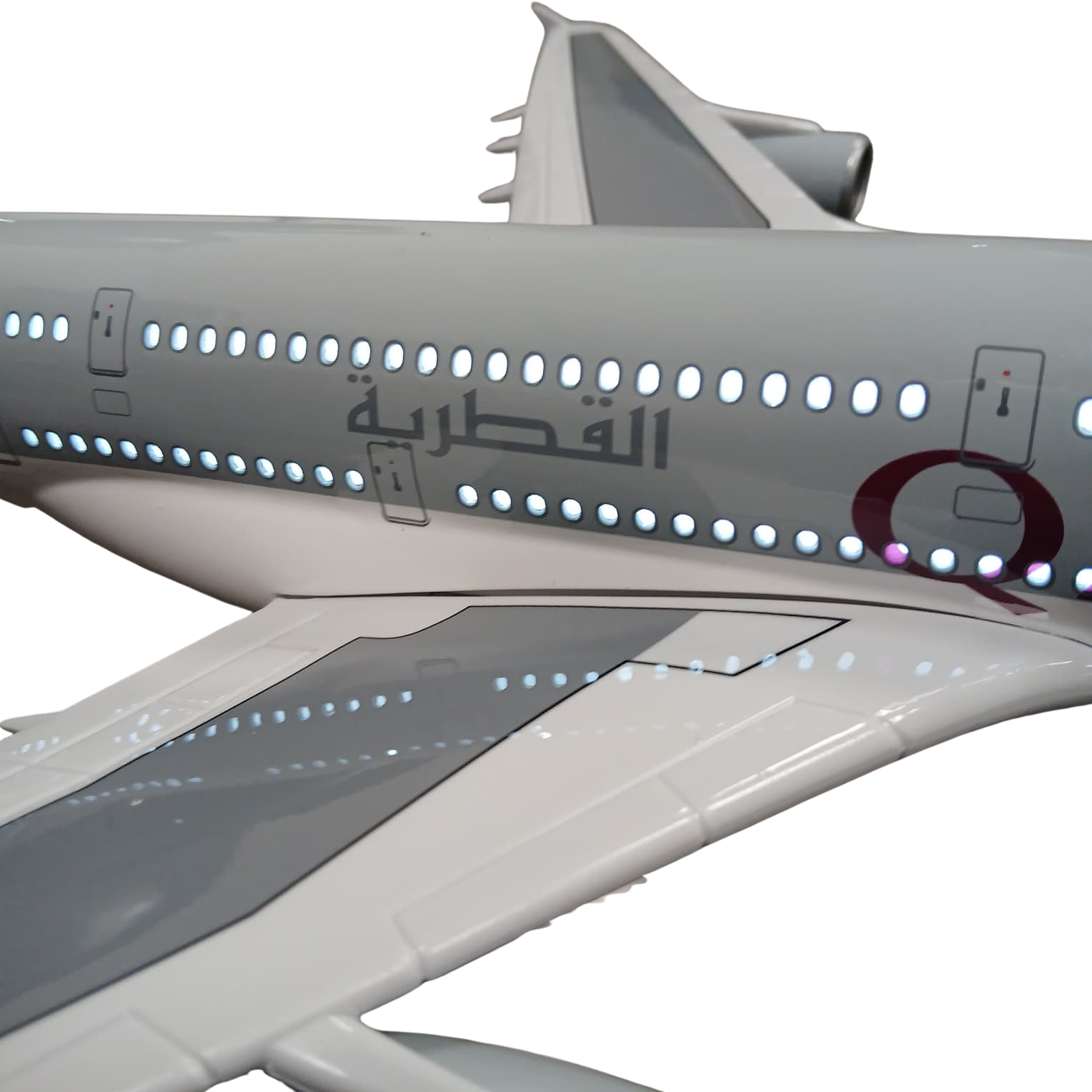 Model of an airplane with Qatar Airways logo on a white background with lights