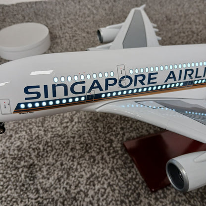 Model of a A380 Singapore Airlines airplane with lights on