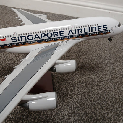 Model of a A380 Singapore Airlines airplane on a textured surface