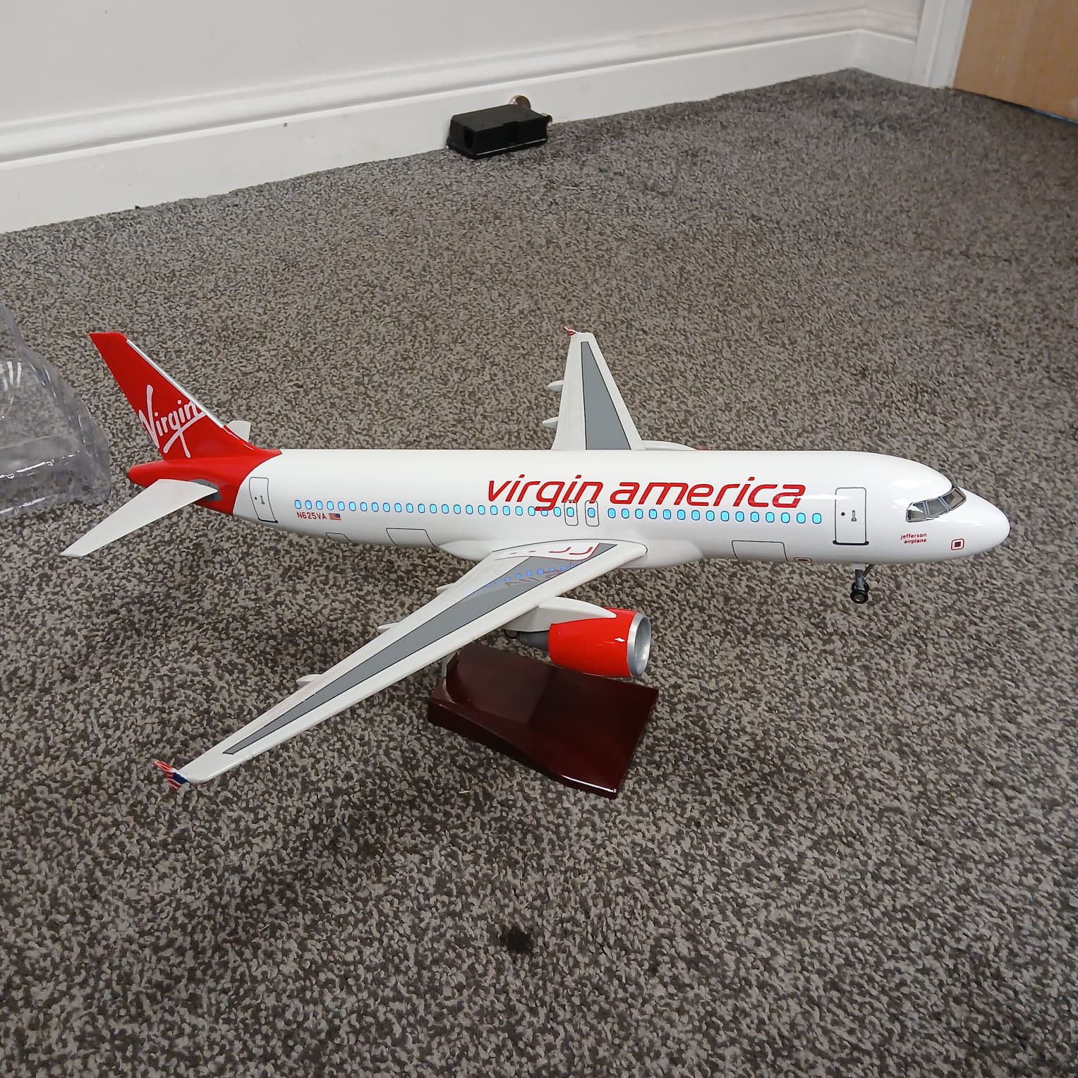 Model of a Virgin America airplane on a carpeted floor