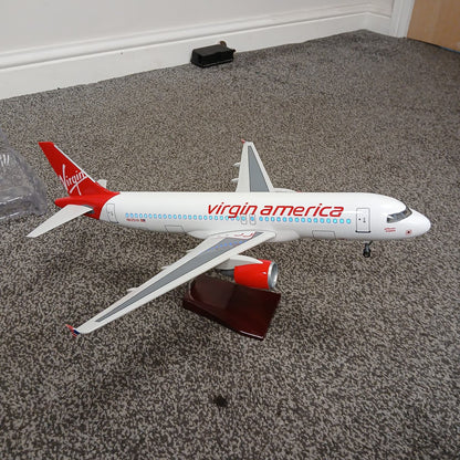 Model of a Virgin America airplane on a carpeted floor